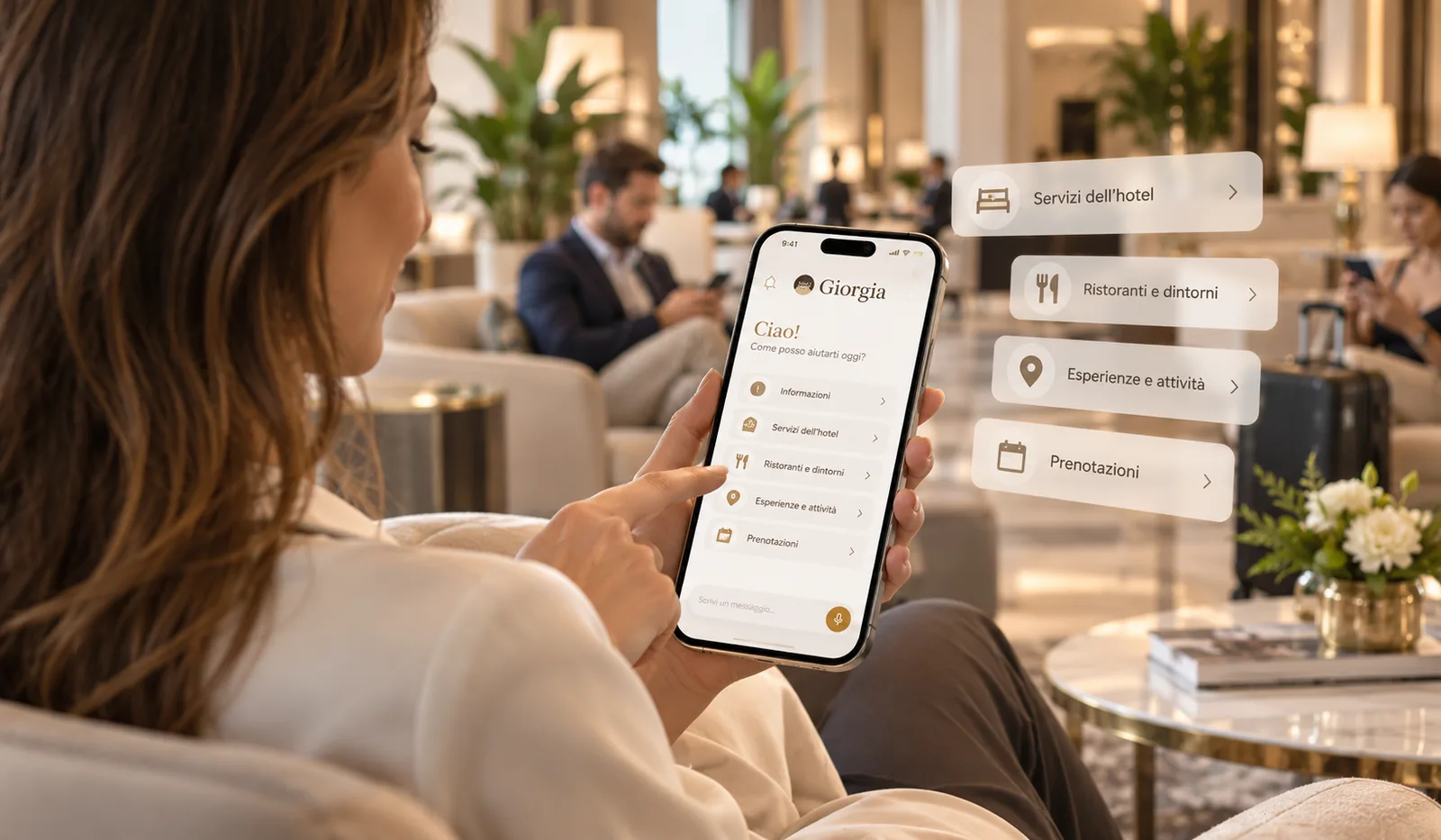 Ospite che usa Giorgia sullo smartphone nella lounge dell’hotel